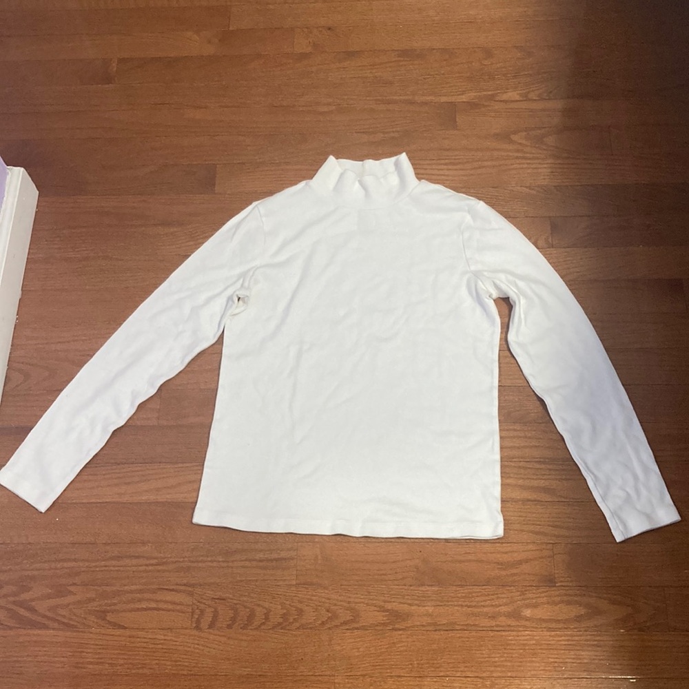 It’s a turtleneck only worn once and without tag